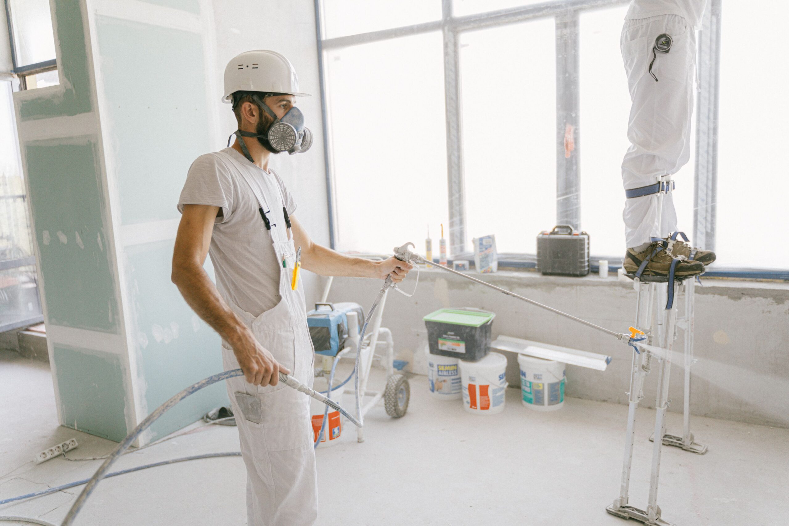 Workers renovating a home interior