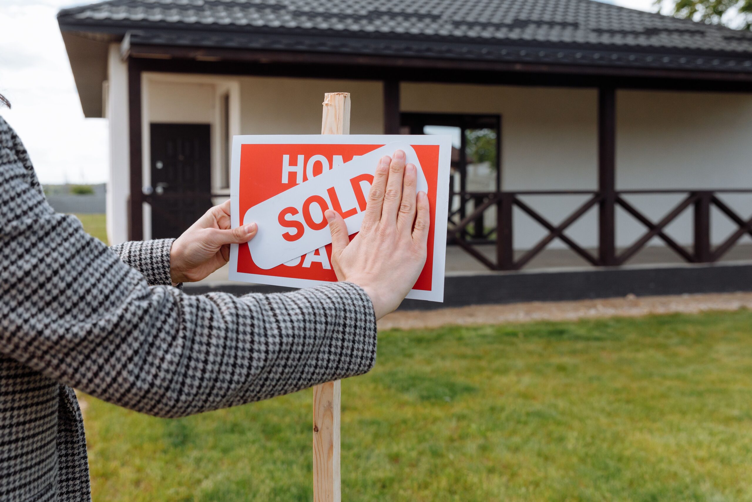Sold sign in front of a house